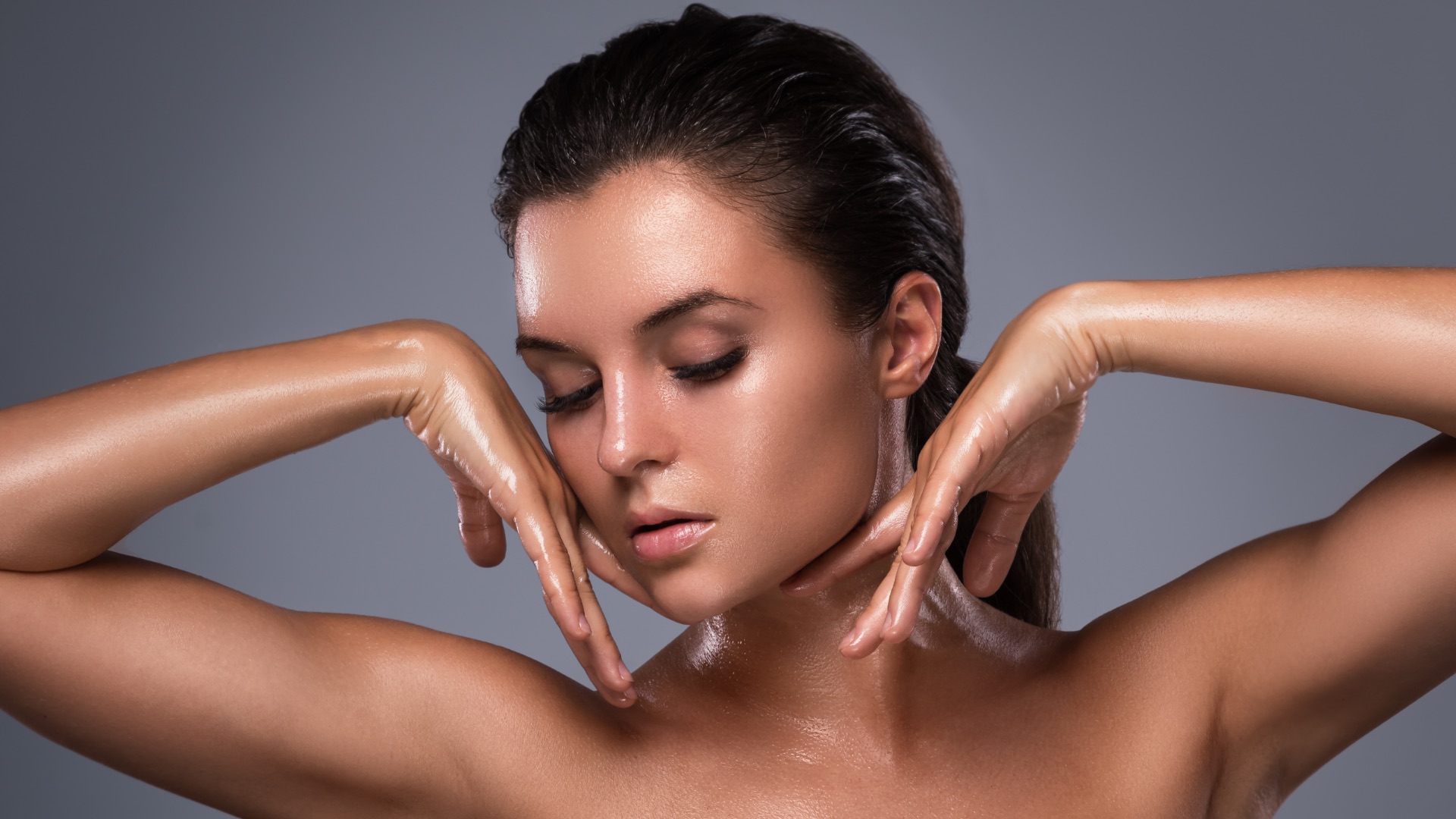 Potrait of young beautiful woman with oily and wet skin